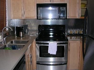 Diamond plate in the kitchen back splash from The Metal Link